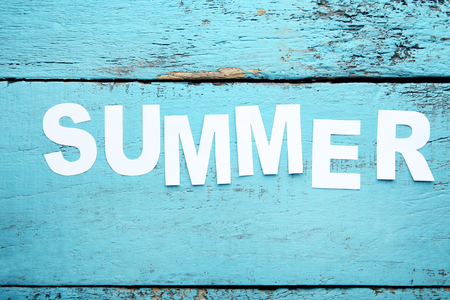 Inscription Summer on blue wooden tableの写真素材