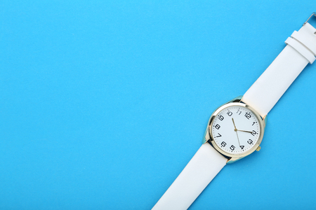 Wrist watch on blue backgroundの写真素材