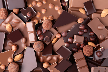 Chocolate pieces with nuts and candy ballsの写真素材