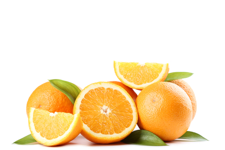 Orange fruit with green leafs isolated on white backgroundの写真素材
