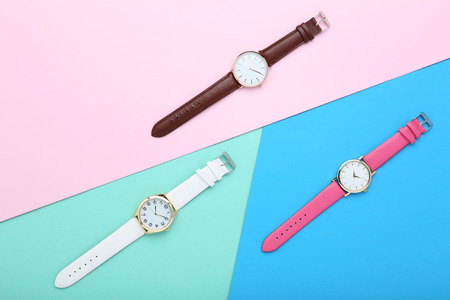 Wrist watches on colorful background