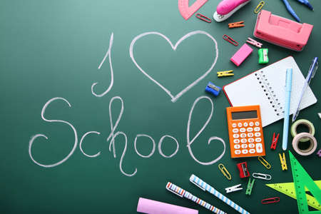 Inscription I Love School on chalkboard with school suppliesの写真素材