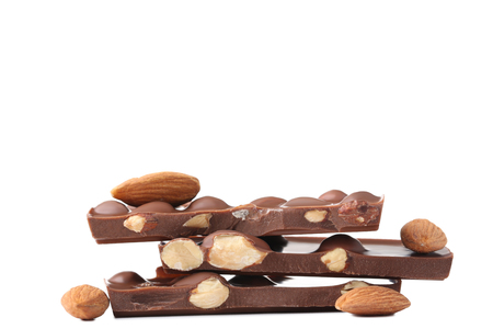 Chocolate pieces with almonds isolated on white backgroundの写真素材
