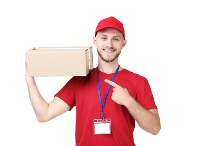 Delivery man with cardboard box on white background