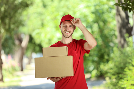 Delivery man with cardboard boxesの写真素材