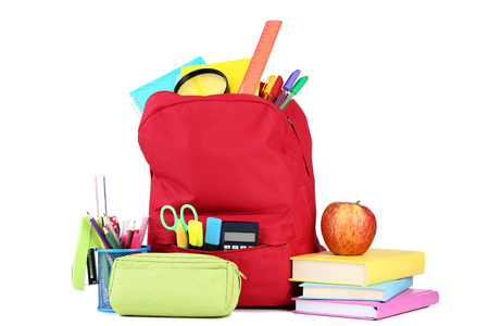 Red backpack with school supplies on white backgroundの写真素材