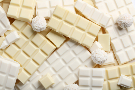 Chocolate pieces and coconut candies backgroundの写真素材