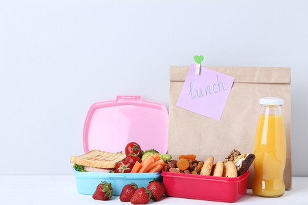School lunch with paper bag on grey backgroundの写真素材