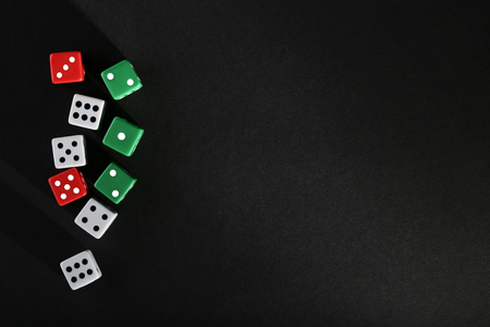 Colourful dice on black backgroundの写真素材