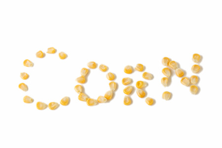 Inscription by corn on white backgroundの写真素材