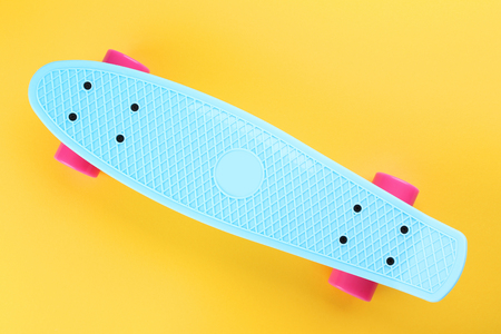 Skateboard on yellow backgroundの写真素材