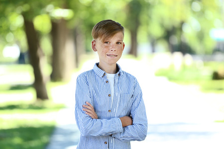 Portrait of young boy in the parkの写真素材