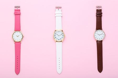 Wrist watches on pink backgroundの写真素材