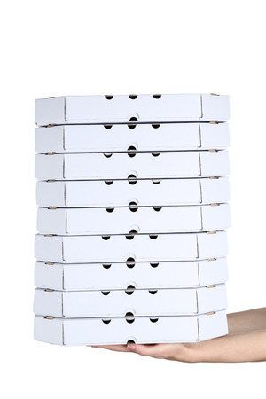 Female hands holding pizza boxes on white backgroundの写真素材