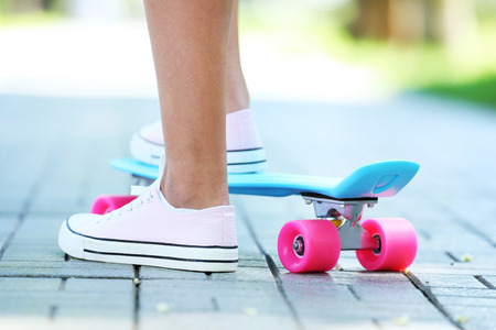 Girl with skateboard in the park