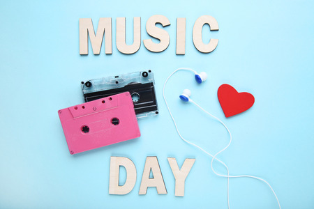 Cassette tapes with earphones and red heart on blue backgroundの写真素材