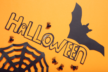 Paper halloween decorations on orange backgroundの写真素材