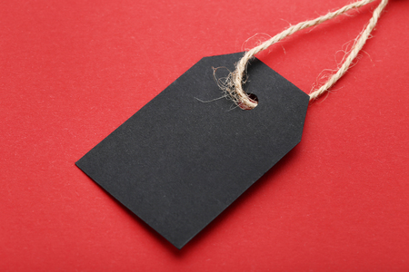 Black sale tag on red backgroundの写真素材