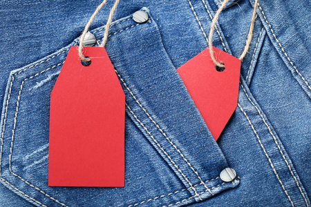 Red sale tags with jeansの写真素材