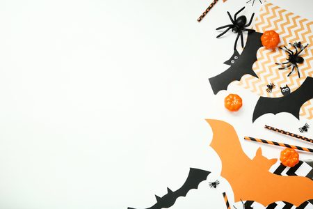 Halloween paper decorations with pumpkins and spiders on white backgroundの写真素材