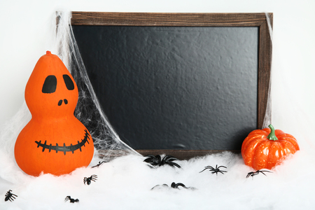 Orange halloween pumpkins with black frame and spidersの写真素材
