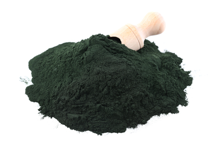 Spirulina powder with scoop isolated on white backgroundの写真素材