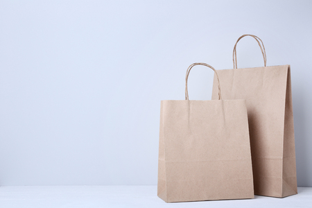 Brown shopping bags on grey backgroundの写真素材