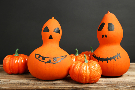 Orange halloween pumpkins on wooden tableの写真素材