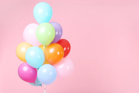 Colored balloons on pink backgroundの写真素材