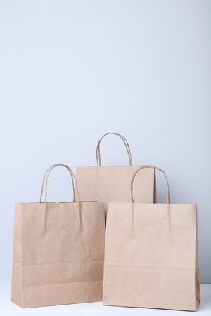 Brown shopping bags on grey backgroundの写真素材