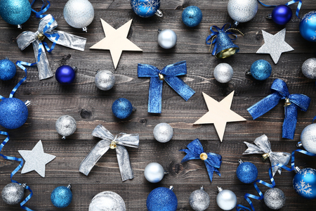 Blue and silver christmas decorations on wooden tableの写真素材