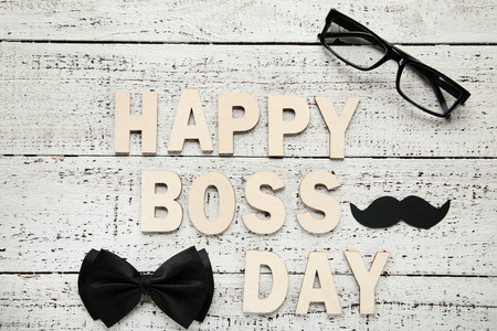 Inscription Happy Boss Day with glasses and bow tieの写真素材
