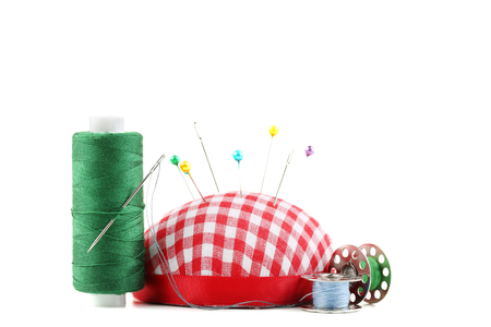 Colored thread with pincushion on white backgroundの写真素材
