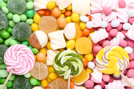Background of sweet candies and lollipopsの写真素材