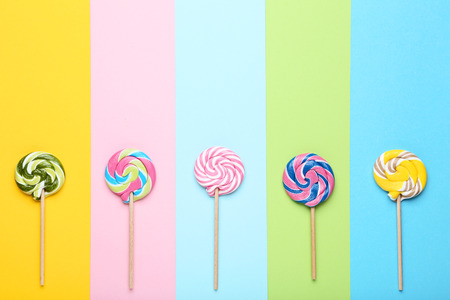 Sweet lollipops on colorful backgroundの写真素材