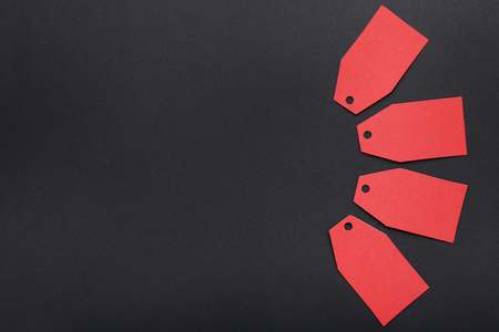 Red sale tags on black backgroundの写真素材