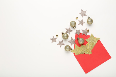 Red envelope with stars and baubles on white backgroundの写真素材