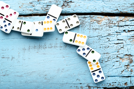 Dominoes on blue wooden tableの写真素材