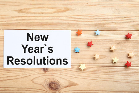 New year resolutions on sheet of paper with colorful starsの写真素材