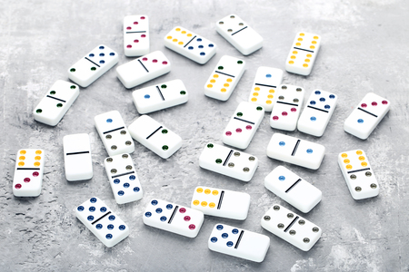 Dominoes on grey wooden tableの写真素材