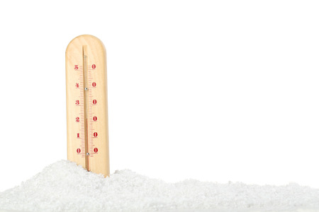 Wooden thermometer in snow on white background