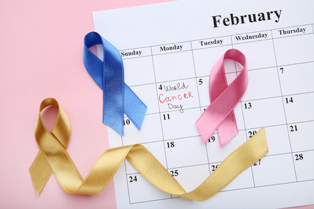 Colorful ribbons with february calendar. Children cancer conceptの写真素材