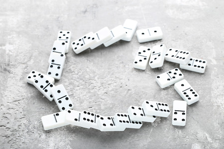 Dominoes on grey wooden table
