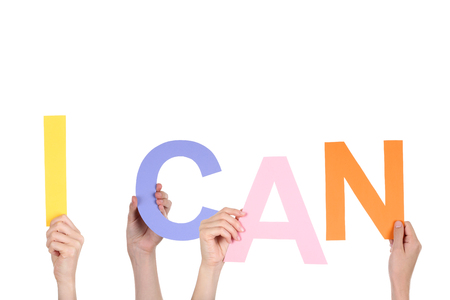 Hands holding the word I Can on white backgroundの写真素材