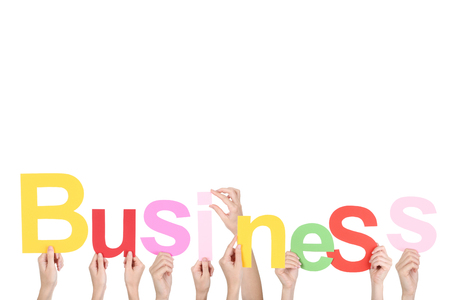 Hands holding the word Business on white backgroundの写真素材