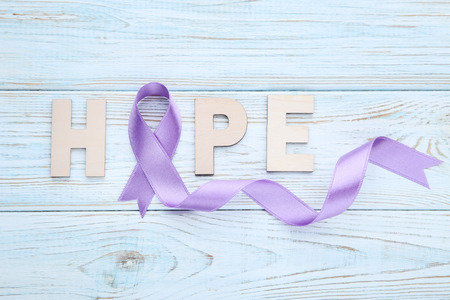 Lilac ribbon with word Hope. Cancer conceptの写真素材