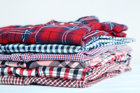 Stack of folded shirtsの写真素材