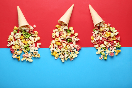 Sweet popcorn in waffles on colorful backgroundの写真素材