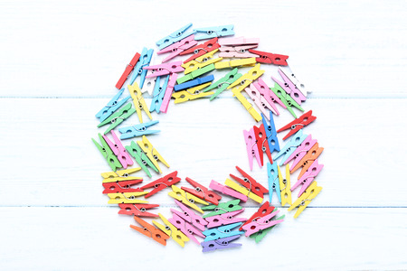 Colorful clothespins on wooden tableの写真素材