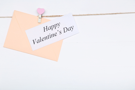 Inscription Happy Valentine Day with envelope on white backgroundの写真素材